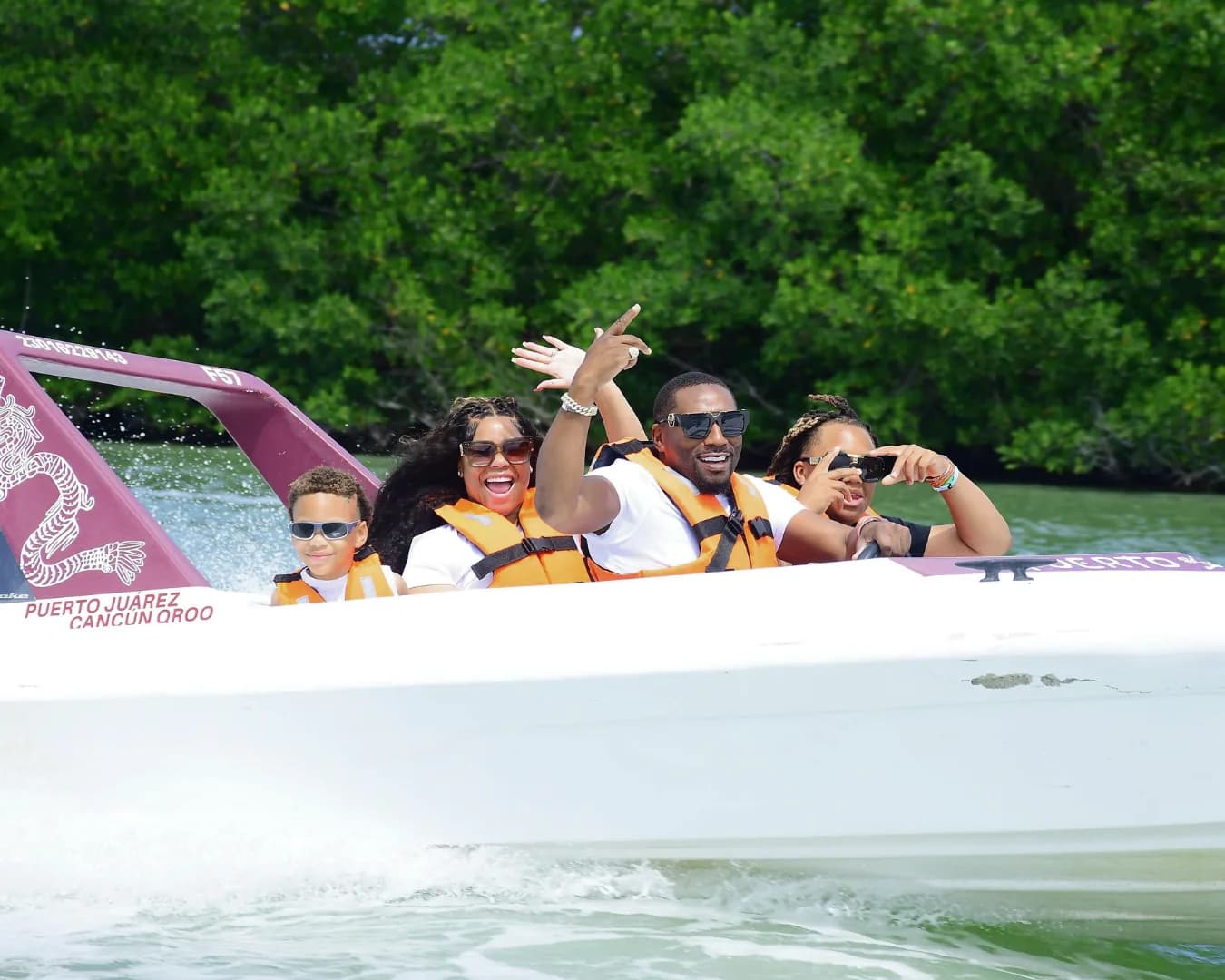Guests riding a Puerto Maya speedboat during a Cancun Jungle Tour.