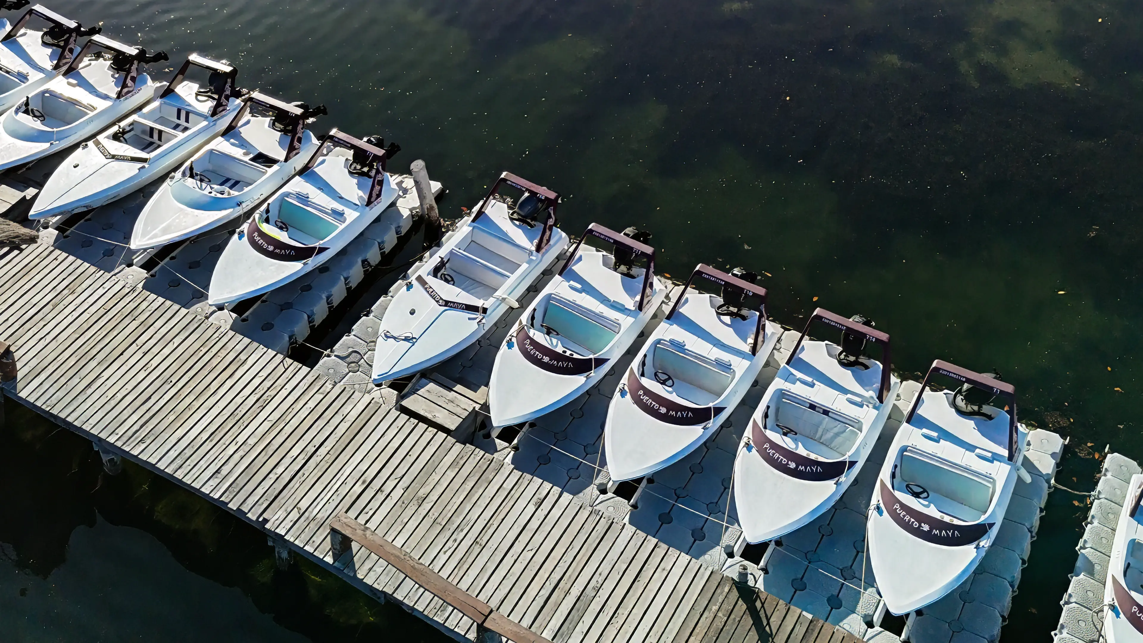 Aerial view of Puerto Maya speedboats docked on the lagoon